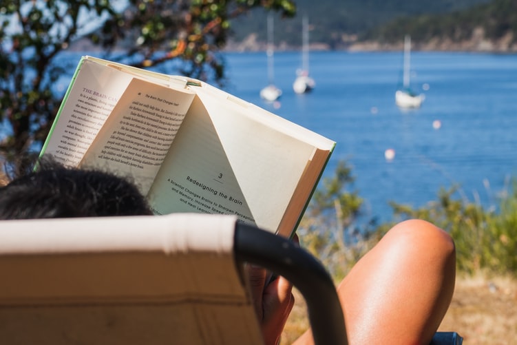 girl reading books on travel